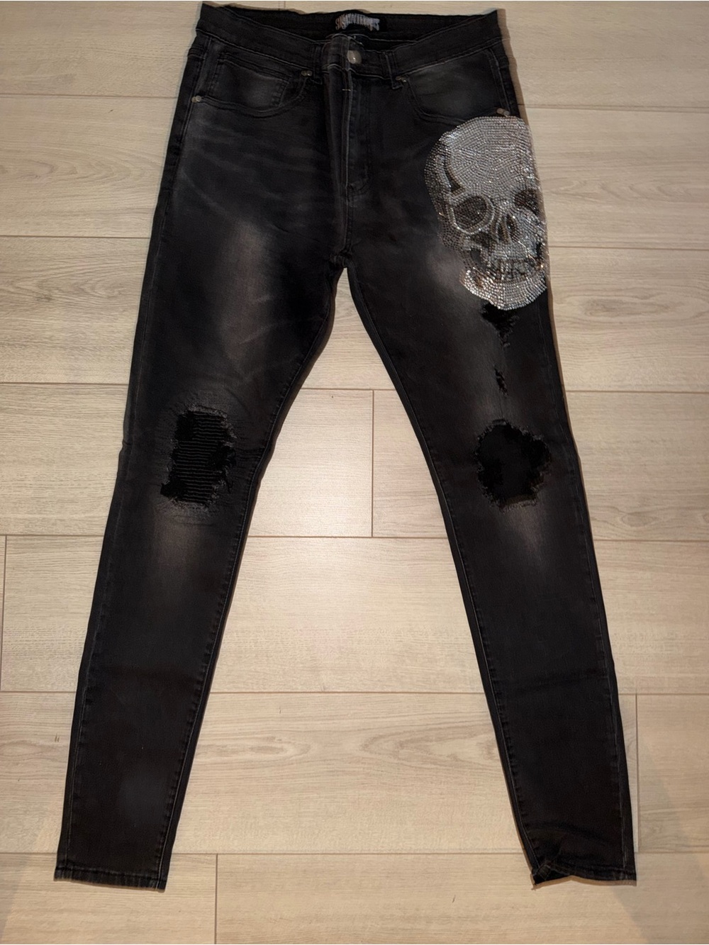 Black Skinny Jeans with Silver Sequin Skull Accent